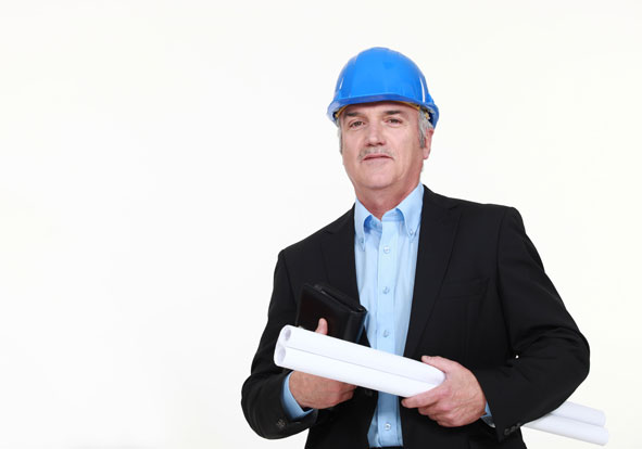 A senior construction manager wearing a blue hard hat and holding building plans, showcasing professionalism.