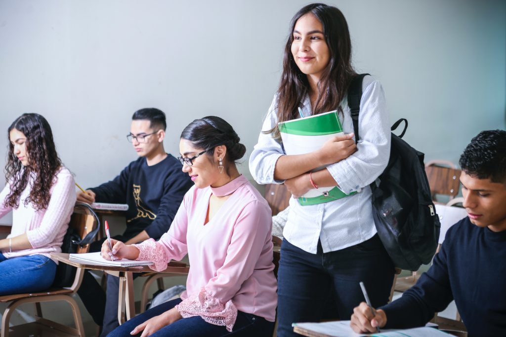 Students attentively learning in a classroom, highlighting practical personal safety tips for academic settings.