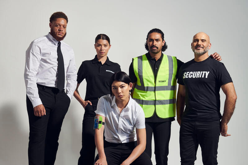 A diverse group of security professionals in uniform showcasing various roles in the security industry.