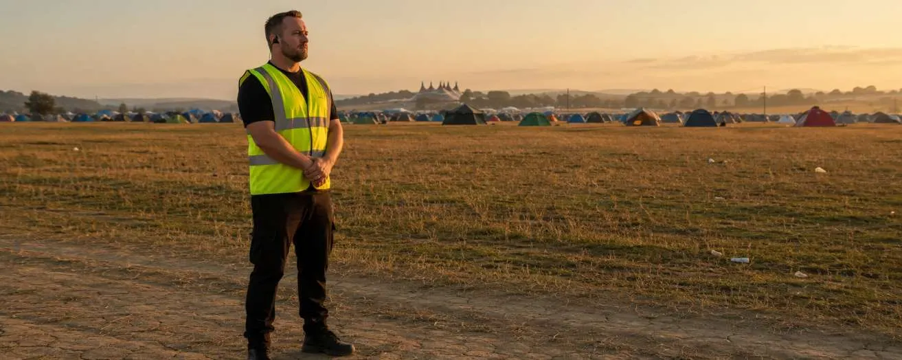 a security officer at a countryside festival