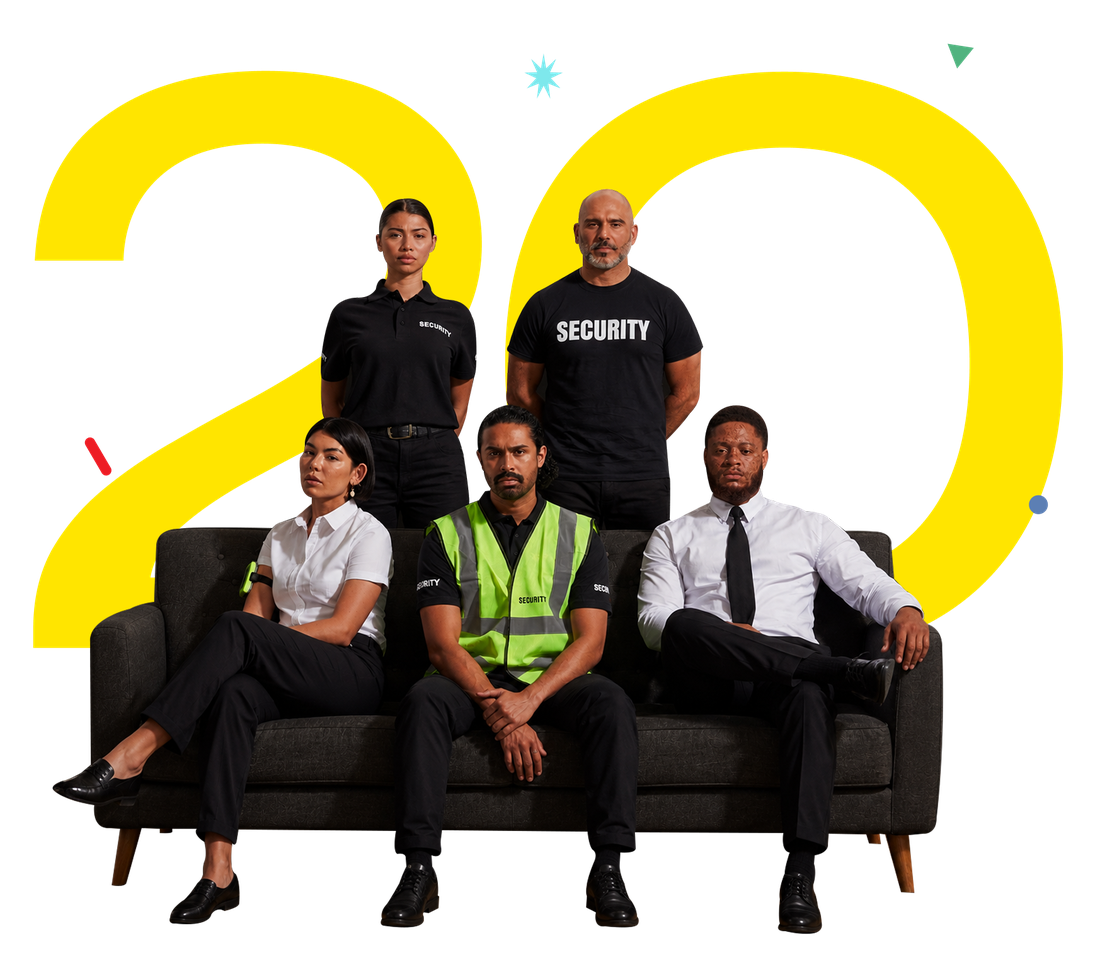Security professionals in front of a large yellow 20