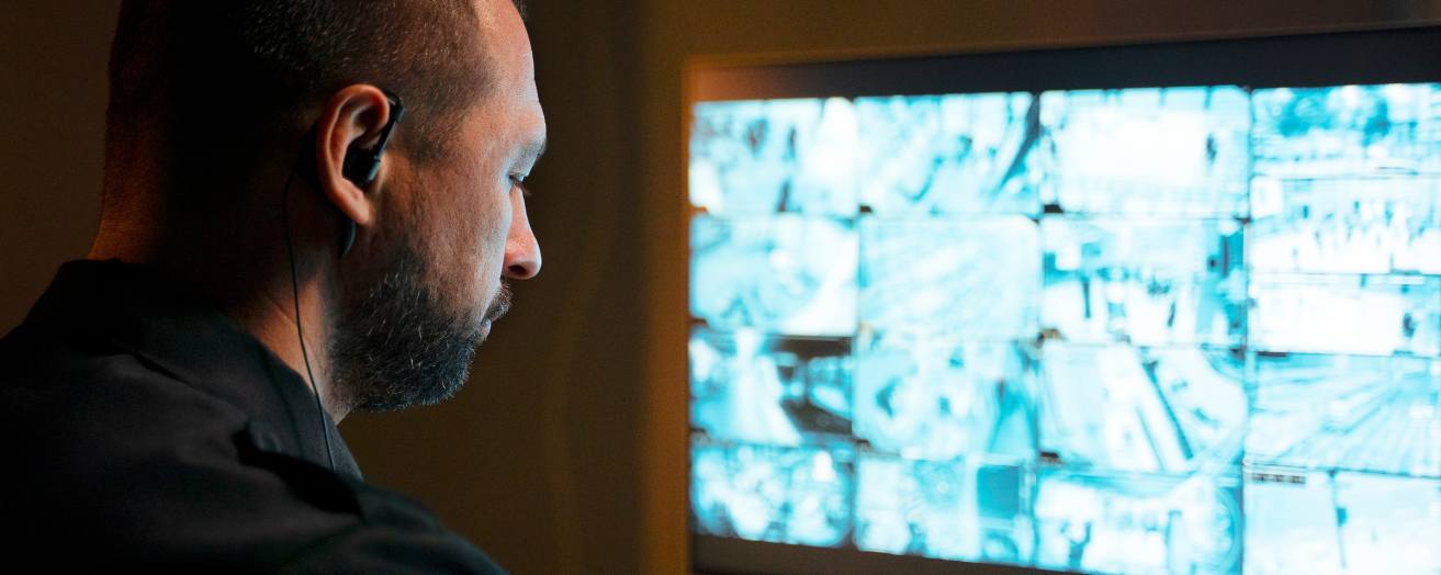 A CCTV operator looking at a monitor